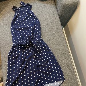 Navy and white polka dot romper. Halter neck, belted and with pockets!